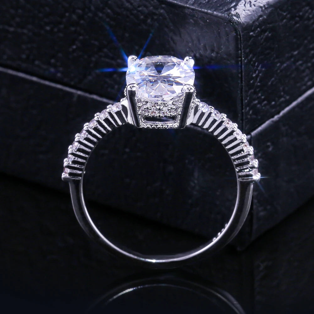 Huitan Oval Finger Ring Band Dazzling Brilliant CZ Stone Four Prong Setting Classic Wedding Anniversary Gift for Wife&Girlfriend